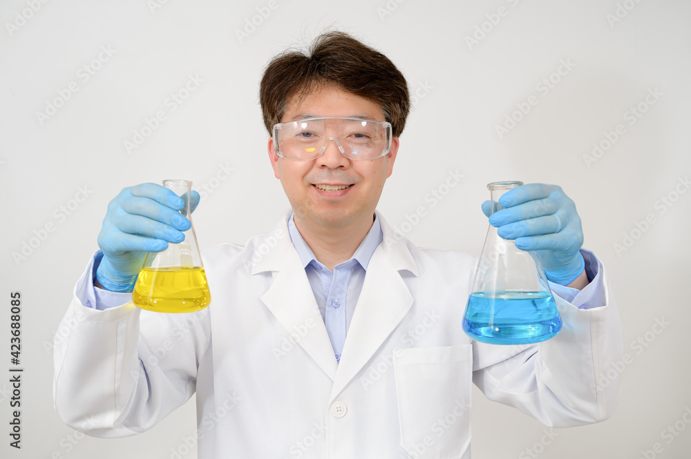 Portrait of a middle-year Asian male scientist wearing a white lab gown and gloves and holding an experimental container in his hand. Portrait of a middle-year Asian male scientist wearing a white lab gown and gloves and holding an experimental container in his hand.