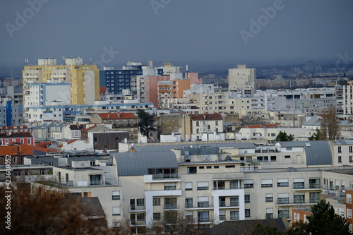 A view on the parisian suburbs from a hill of the north of Paris. "Butte du chapeau rouge" the hill of the red hat, a park in the north of Paris. the 21st march 2021. © Yann Vernerie