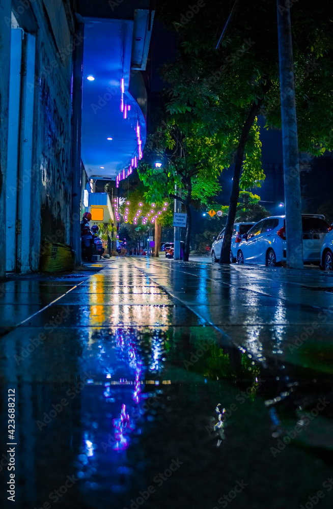 Sidewalk at night with decorative lights