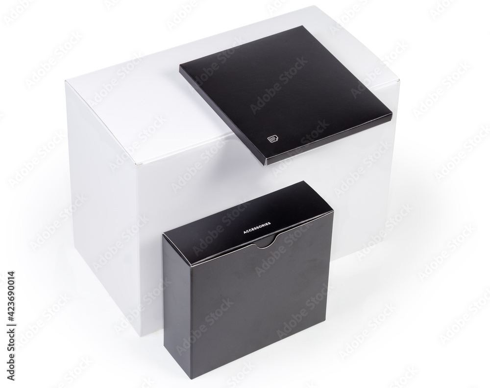 White cardboard packing box, small boxes with accessories and manual White cardboard packing box, small boxes with accessories and manual