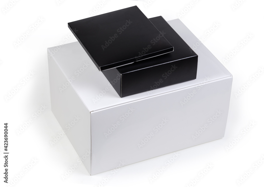 White and black rectangular cardboard packing boxes different sizes White and black rectangular cardboard packing boxes different sizes