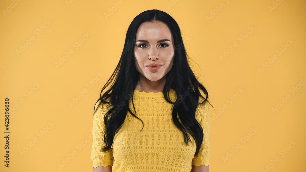 happy, pretty woman smiling at camera isolated on yellow happy, pretty woman smiling at camera isolated on yellow