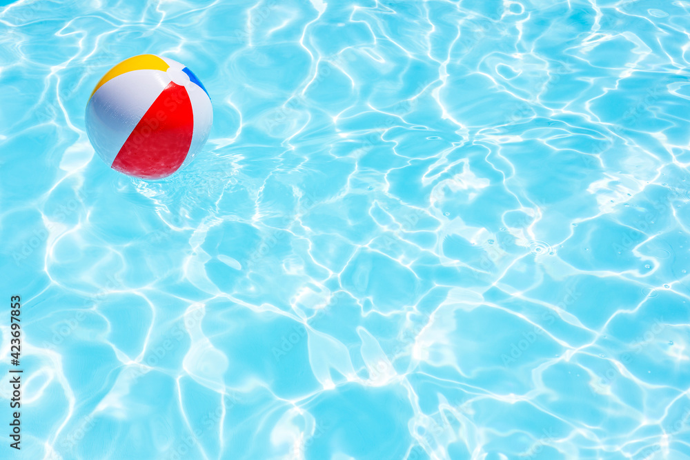 Beach ball in swimming pool background Stock Photo | Adobe Stock