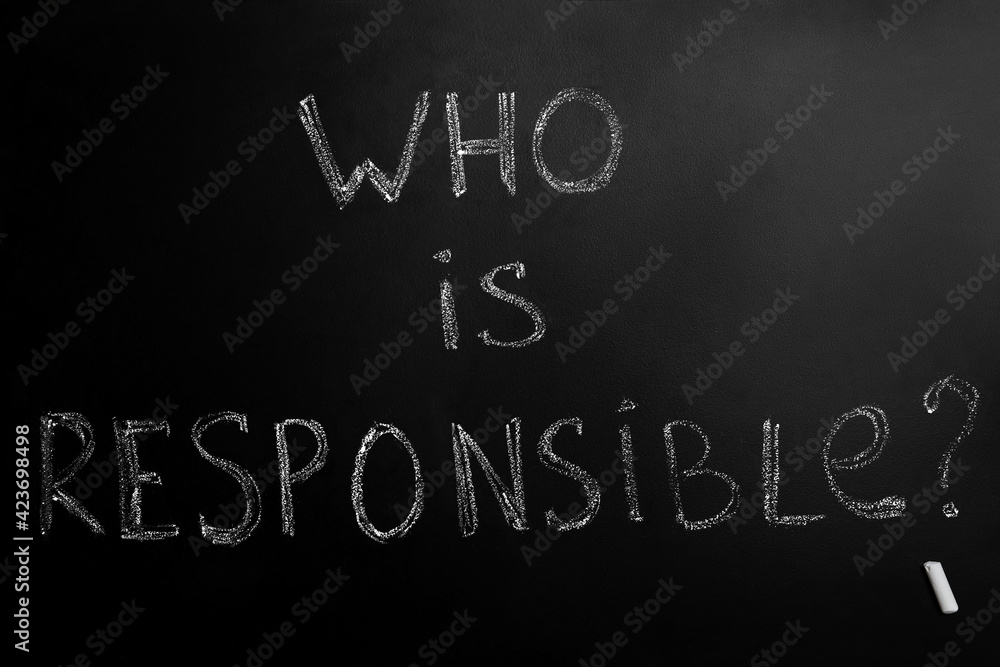Fototapeta premium Question Who Is Responsible and chalk piece on black background
