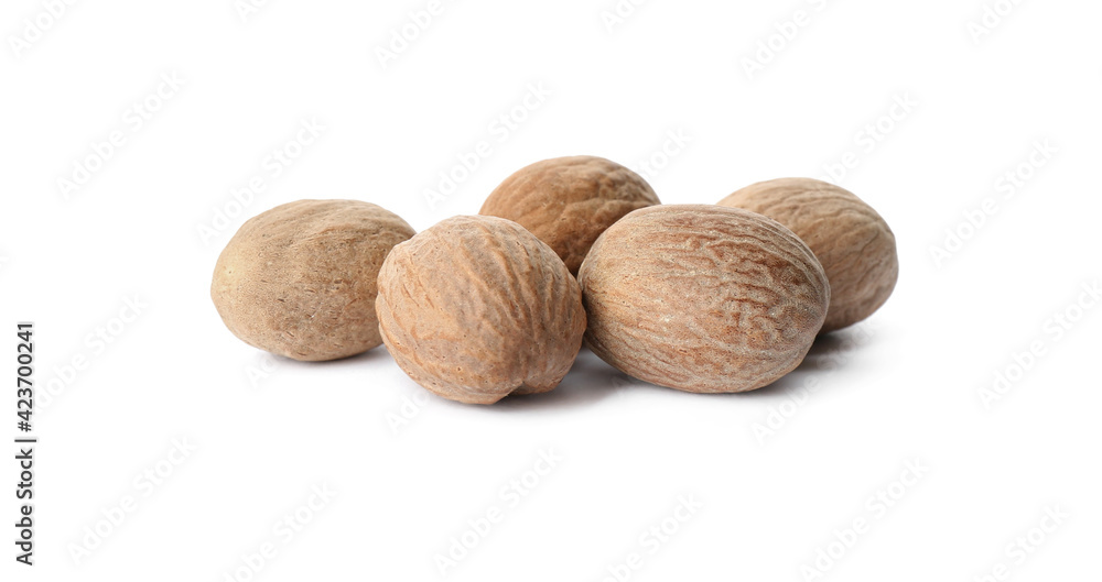 Heap of nutmeg seeds on white background Heap of nutmeg seeds on white background