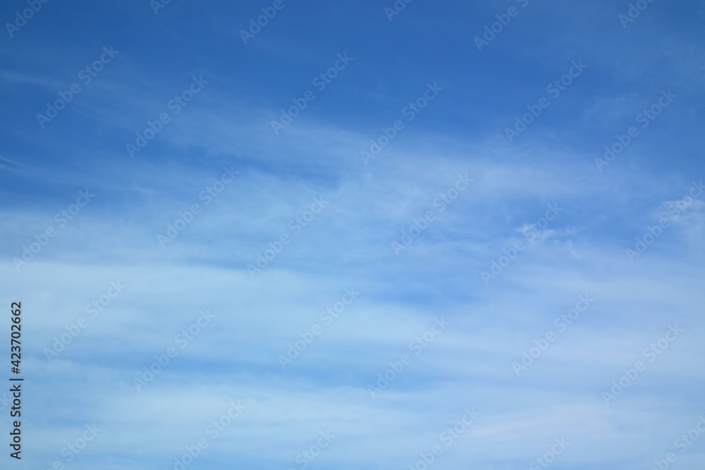 Blue sky with fluffy clouds. Heavenly landscape with white clouds.