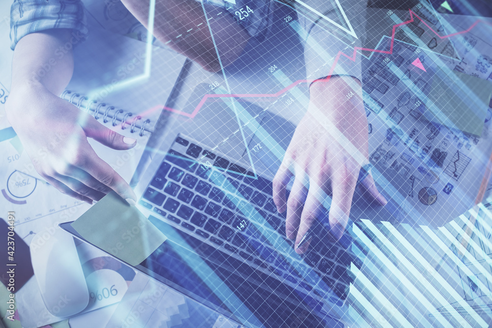 Double exposure of man and woman working together and forex graph hologram drawing. Financial analysis concept. Computer background. Top View. Double exposure of man and woman working together and forex graph hologram drawing. Financial analysis concept. Computer background. Top View.