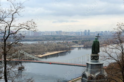 The Saint Vladimir Monument overlooking the bridge and Kyiv cityscape in Ukraine photo