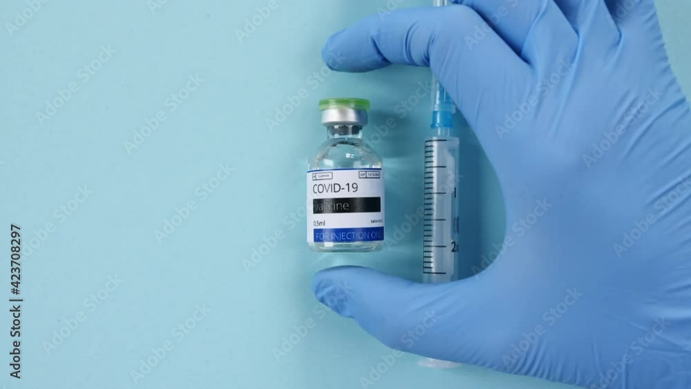 COVID-19 Vaccine in Researcher Hands, Doctor Puts on the Table Bottle with Vaccine for Coronavirus Cure. . High quality 4k footage COVID-19 Vaccine in Researcher Hands, Doctor Puts on the Table Bottle with Vaccine for Coronavirus Cure. . High quality 4k footage