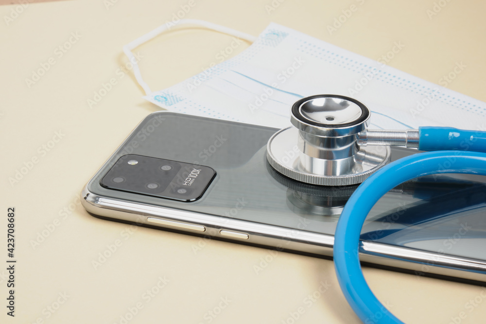 Doctor online concept, face mask with stethoscope, virtual hospital