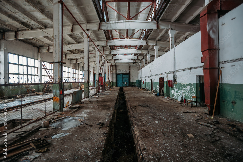 Old broken empty abandoned industrial building interior