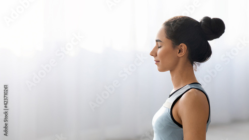 Free Download Closeup of yoga woman meditating at home, side view - GFXLoad
