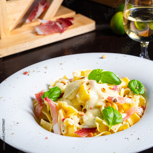 Tagliatelle with gorgonzola masarpone sauce and ham. photo