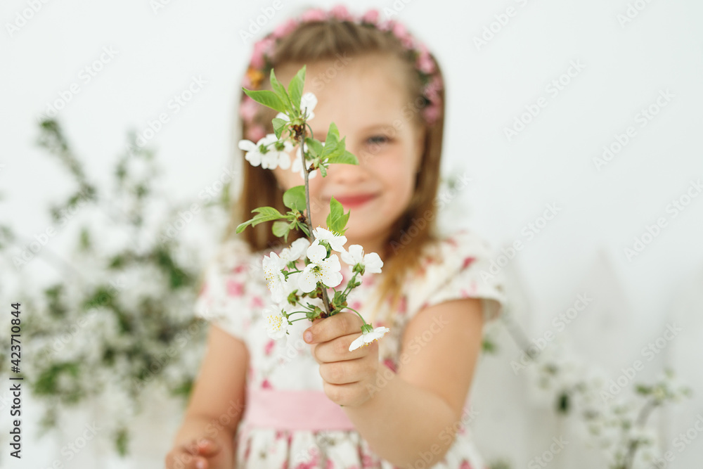Close up of little girl with white flowers Close up of little girl with white flowers