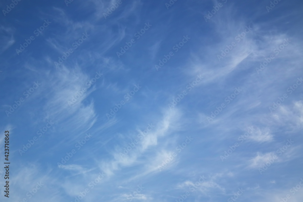 Blue sky with wispy clouds. Heavenly landscape with white clouds. Blue sky with wispy clouds. Heavenly landscape with white clouds.