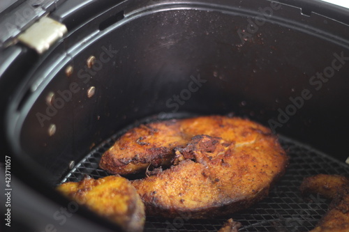 Cobia fish inside the air fryer. In India it is called Moda fish photo