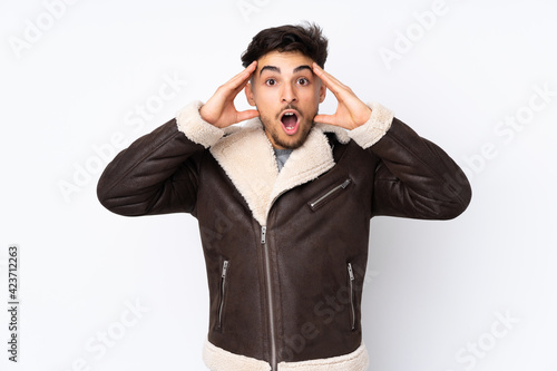 Arabian handsome man over isolated background with surprise expression