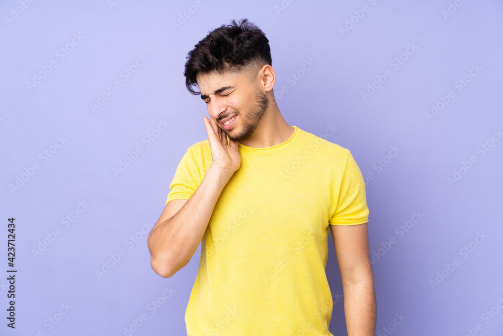 Arabian handsome man over isolated background with toothache Arabian handsome man over isolated background with toothache