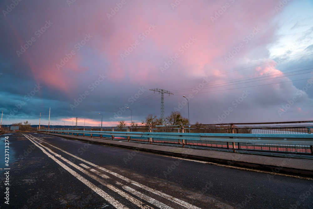 Stormy sunset over the road bridge