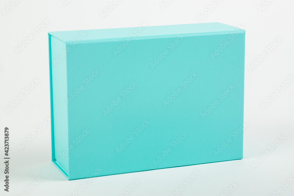 Blue box on a white background. Close-up. Blue box on a white background. Close-up.