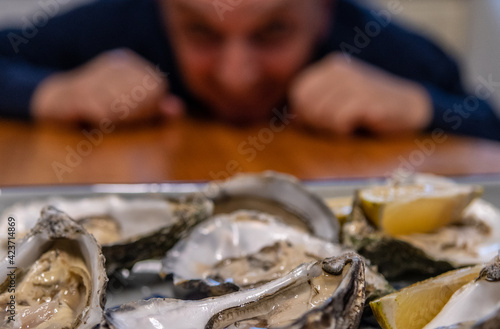 Isolated Close up of Fresh Oysters With Lemon