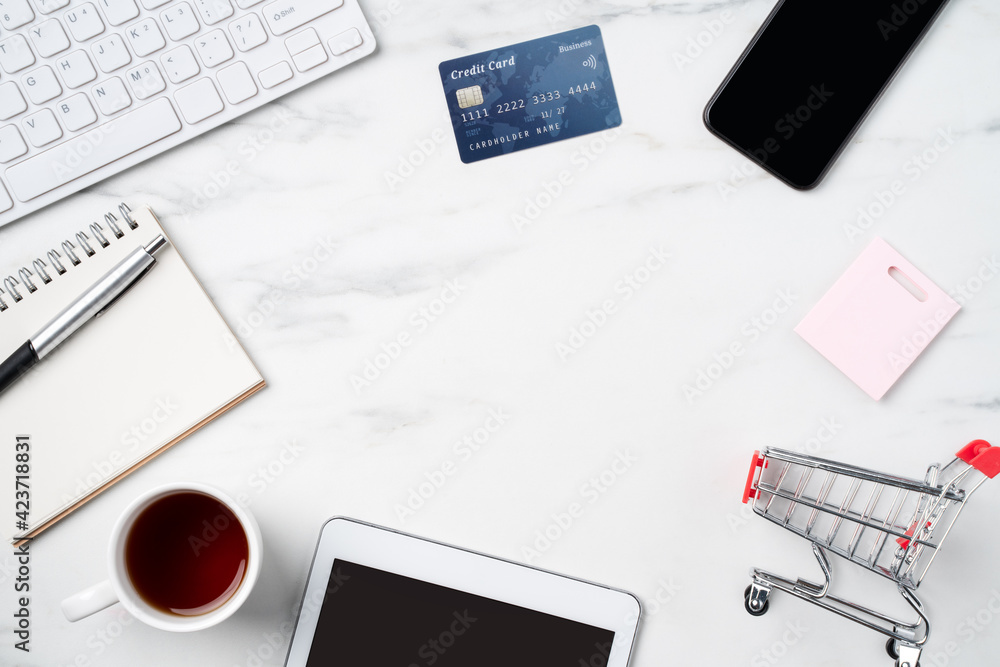 Top view of online shopping concept with credit card and electronics. Top view of online shopping concept with credit card and electronics.