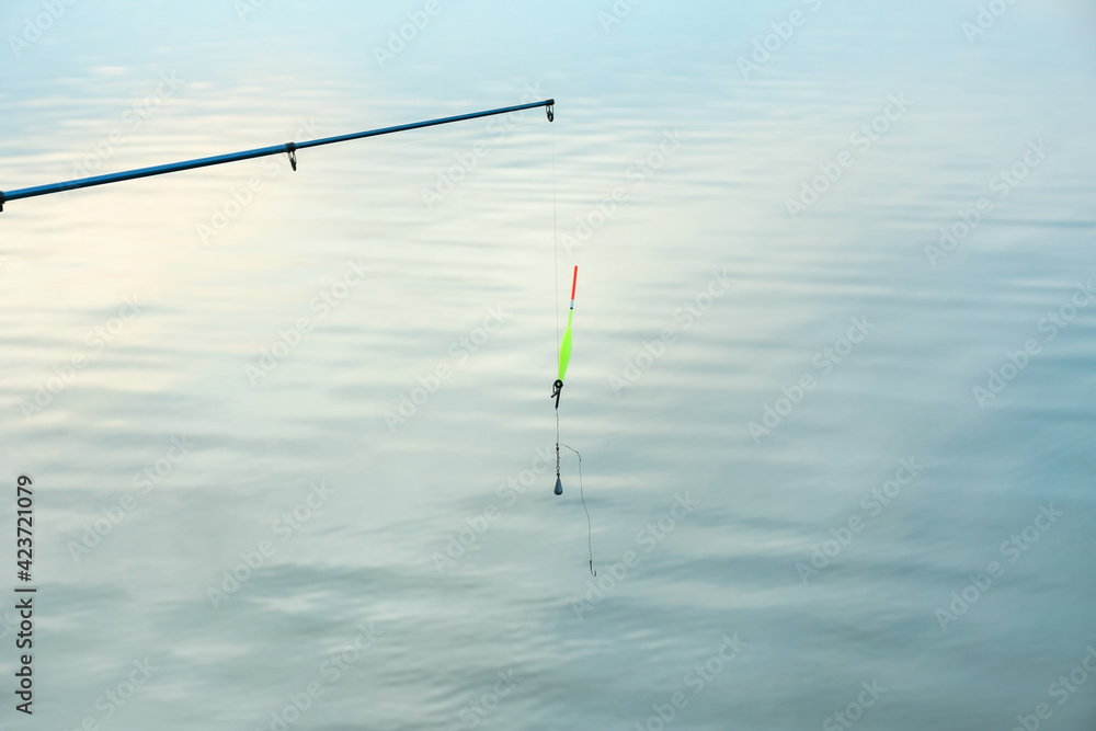 Fishing in river on summer day