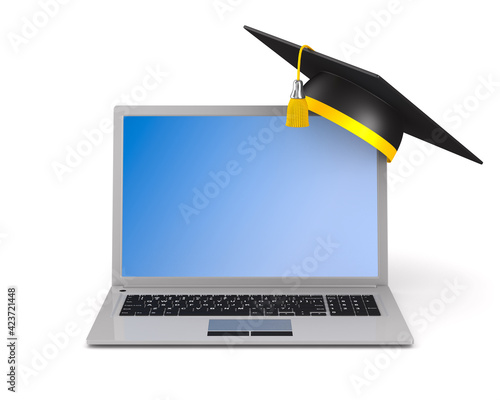 laptop and graduation cap o...