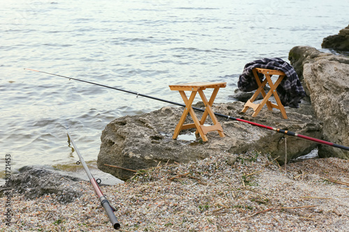 Fishing rods and wooden sto...