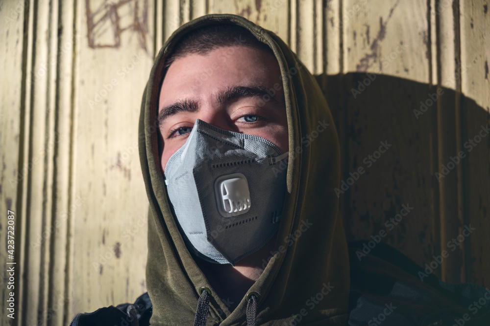 portrait of a young man with a FFP3 corona mask