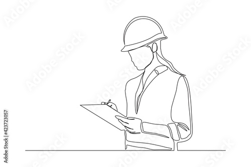 Continuous line drawing of young female architect engineer worker standing while write business note on paper at clipboard wearing safety helmet. One single line business woman workshop concept. Vecto
