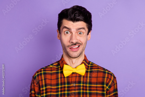 Photo of funky impressed young man dressed checkered shirt staring speechless isolated purple color background
