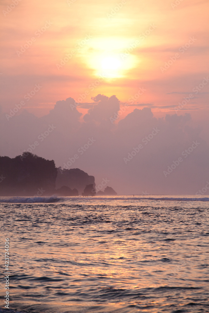 empty background with beautiful scenic ocean sunset sky, rocks and waves