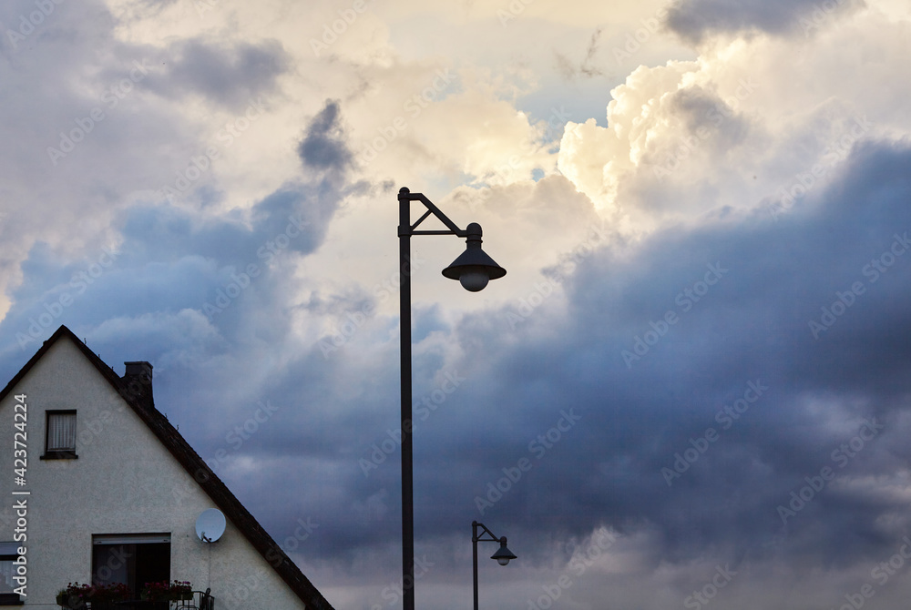 Street light with a dramatic cloud scenario.