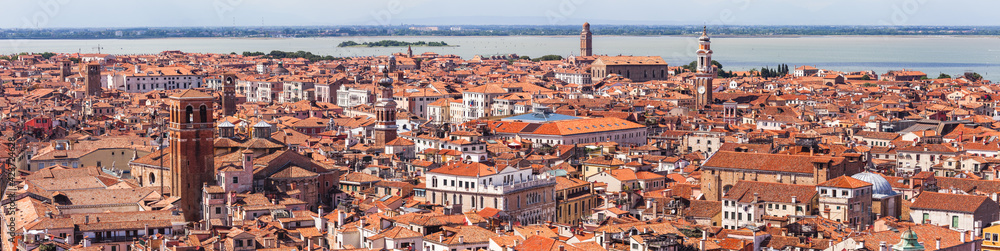 Panaramic view of red rooftops of beautiful Venice with San Marco bell tower