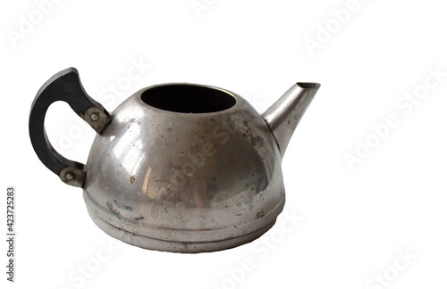 A small old metal teapot on a white background.