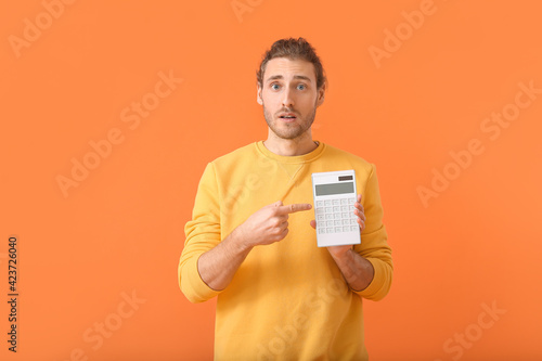 Shocked man with calculator...