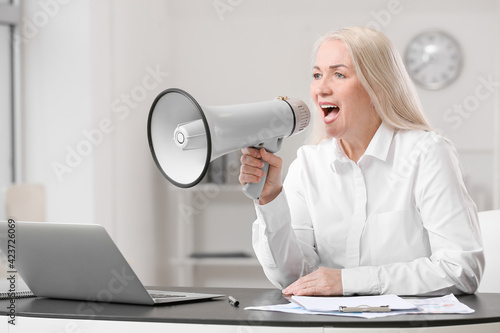 Stressed mature woman with ...
