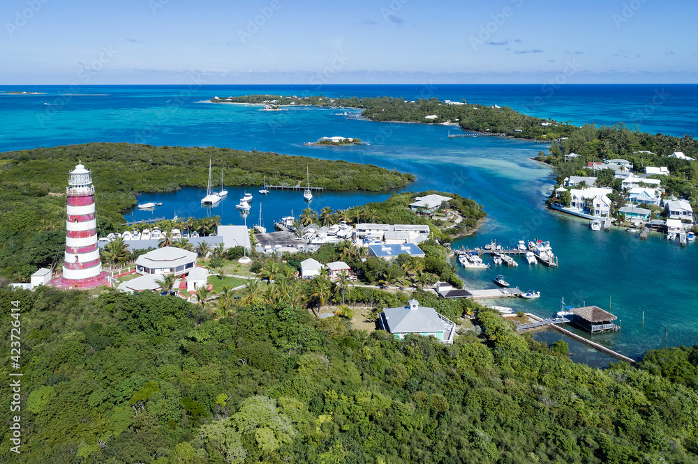 Aerial view of the harbour and lighthouse in Hope Town on Elbow Cay off the island of Abaco, Bahamas.