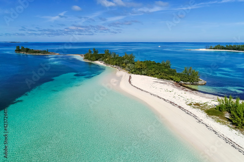 Aerial view of Munjack Cay with bay and beach in Abaco, Bahamas. Green turtles and stingrays inhabit the area. photo