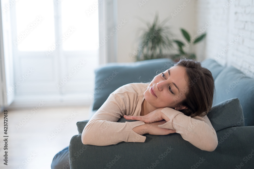 Beautiful lifestyle portrait of young woman happy and relaxed at home Beautiful lifestyle portrait of young woman happy and relaxed at home