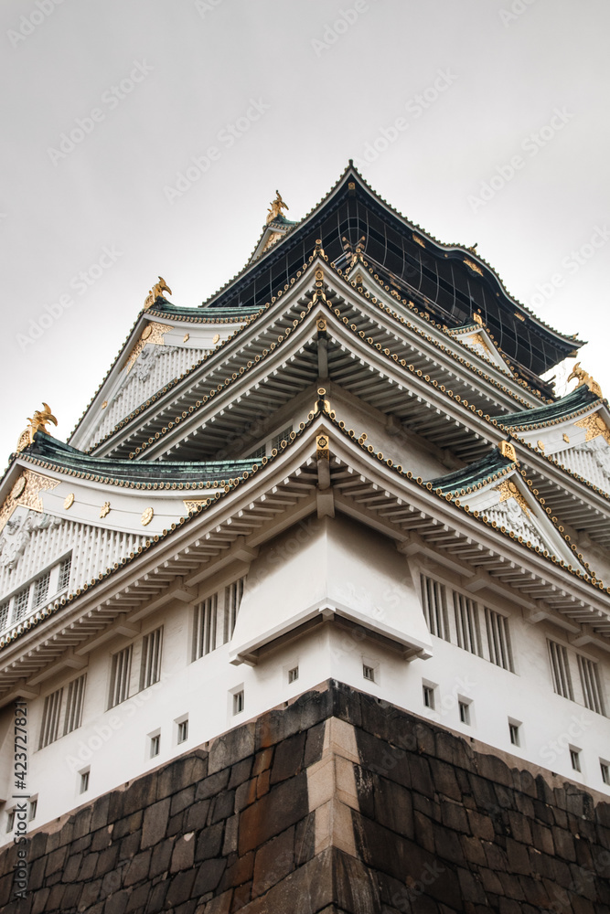 Osaka's Castle incredible and imposing monument with beautiful nature from below