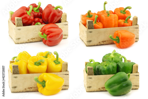 Fresh cooking vegetables in a wooden crate on a white background photo