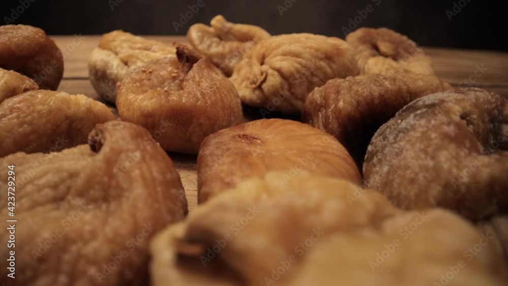 Dried figs on a wooden board - studio photography Dried figs on a wooden board - studio photography