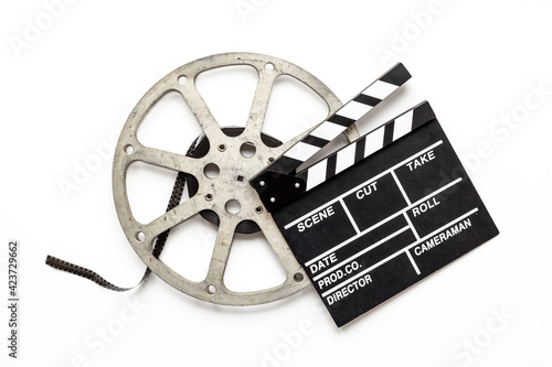 Movie film reel with clapperboard. Cinema concept