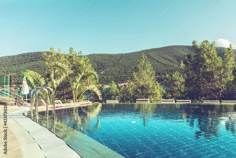 BODRUM,TURKEY : JULY 10, 2018 - Luxury Pool above the Sea with Mountain View