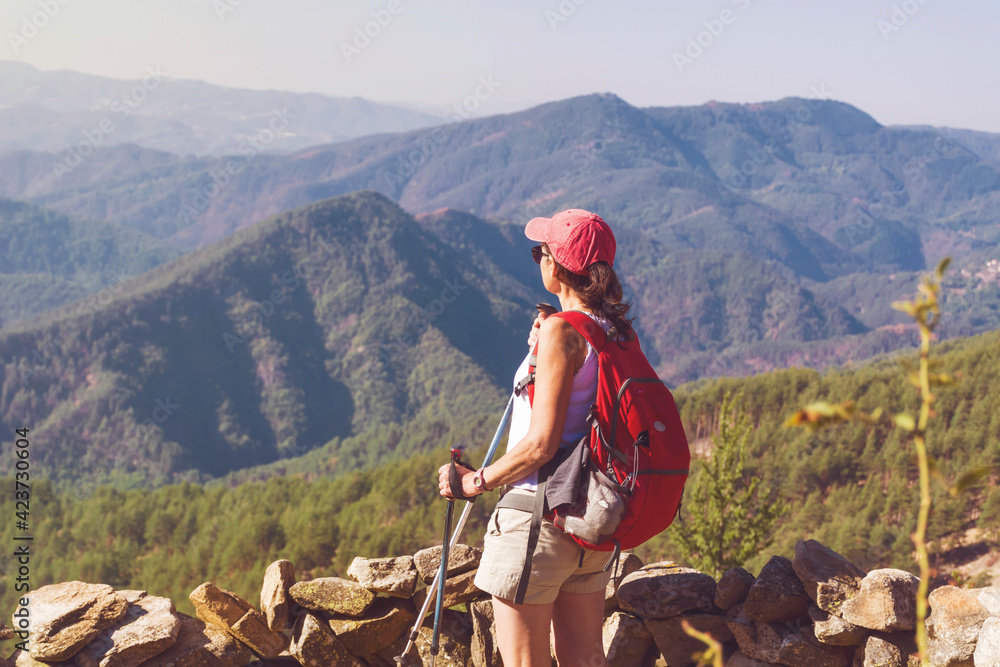 Fototapeta premium Hiker Woman with Backpack on the Top of a Mountain with Stunning View. Pirin Mountain ,Bulgaria
