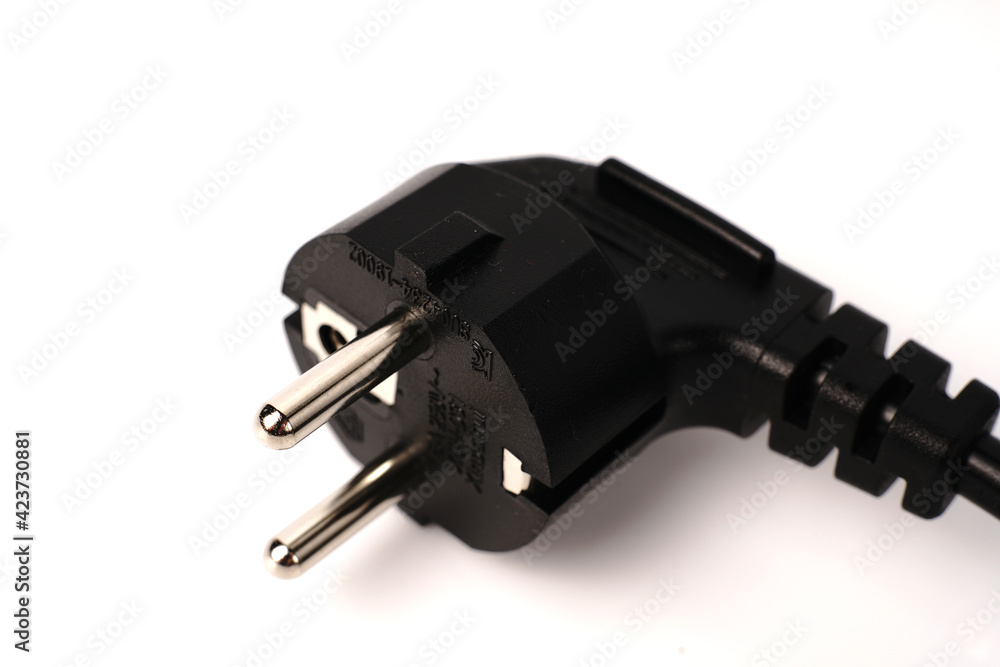 Black PC power cable on white background. Close Black PC power cable on white background. Close