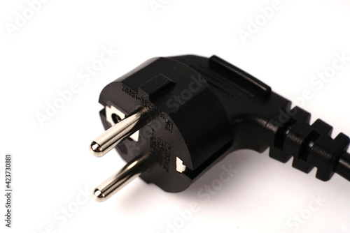 Black PC power cable on white background. Close