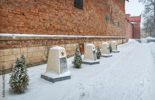 Alley of memory of the cities of Military Glory near a brick wall in Smolensk. Inscription: cities of military glory - Mozhaisk, Khabarovsk, Staraya Russa #423731810